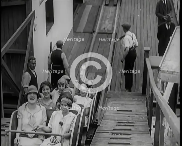 A Large Group of Female Civilians Enjoying  a Roller Coaster Ride, 1926. Creator: British Pathe Ltd.