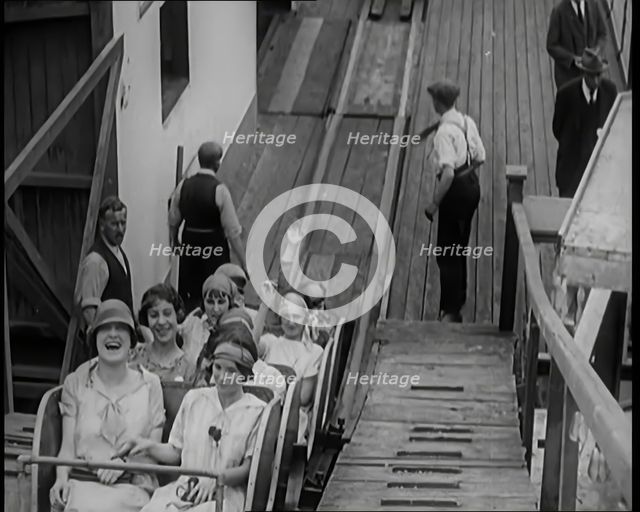 A Large Group of Female Civilians Enjoying  a Roller Coaster Ride, 1926. Creator: British Pathe Ltd.