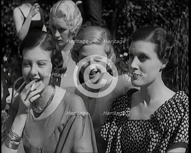 A Large Group of Female Civilians Posing for Photos, 1931. Creator: British Pathe Ltd.