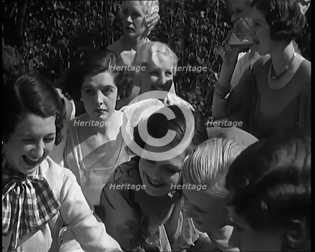 A Large Group of Female Civilians Posing for Photos, 1931. Creator: British Pathe Ltd.