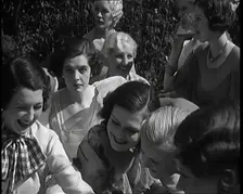 A Large Group of Female Civilians Posing for Photos, 1931. Creator: British Pathe Ltd