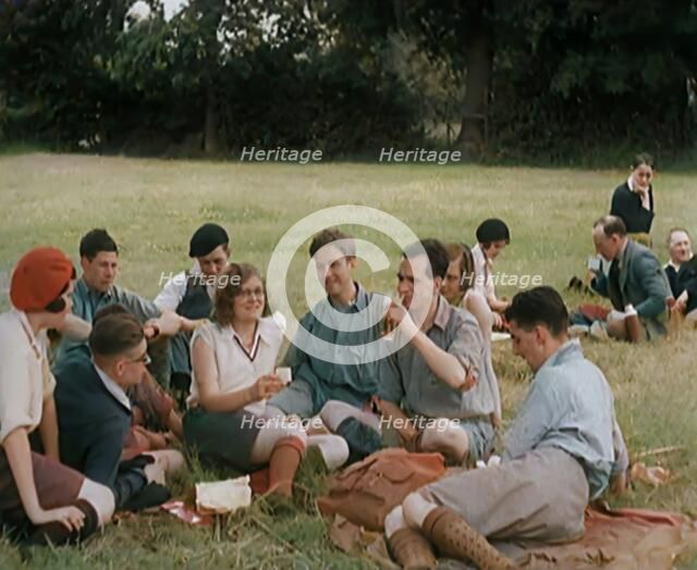 A Large Group of Hikers Having Drinks in a Field, 1931. Creator: British Pathe Ltd.