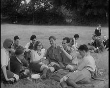 A Large Group of Hikers Having Drinks in a Field, 1931. Creator: British Pathe Ltd