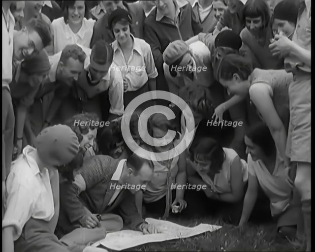 A Large Group of Hikers Setting Off for a Walk in the Countryside, 1931. Creator: British Pathe Ltd.