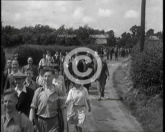 A Large Group of Hikers Walking in the Countryside, 1931. Creator: British Pathe Ltd.