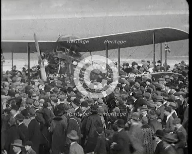 A Large Group of People Crowding Around Sir Alan Cobham's Aeroplane Greeting Him on His..., 1926. Creator: British Pathe Ltd.