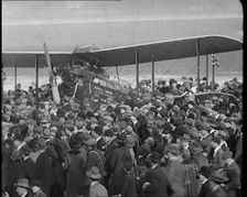 A Large Group of People Crowding Around Sir Alan Cobham's Aeroplane Greeting Him on His..., 1926. Creator: British Pathe Ltd