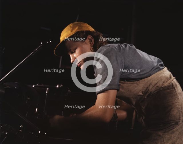 A lathe operator machining parts for...Consolidated Aircraft Corp. plant, Fort Worth, Texas, 1942. Creator: Howard Hollem.