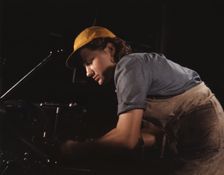 A lathe operator machining parts for...Consolidated Aircraft Corp. plant, Fort Worth, Texas, 1942. Creator: Howard Hollem
