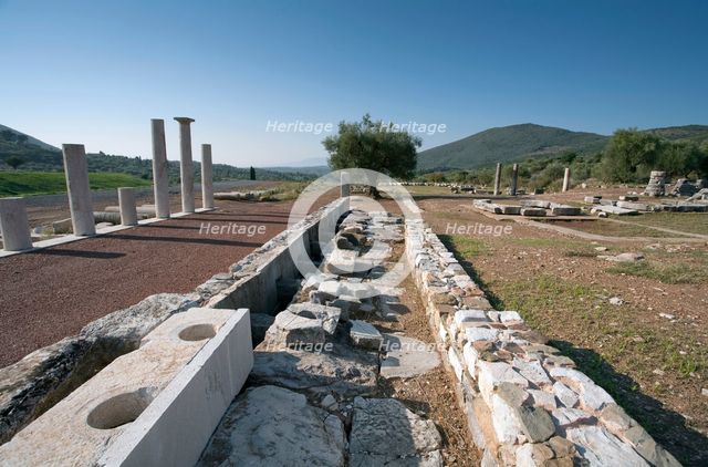 A latrine in Messene, Greece. Creator: Samuel Magal.