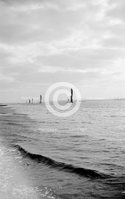 A line of Thames sailing barges, Gravesend Reach, Kent, c1945-c1965. Artist: SW Rawlings