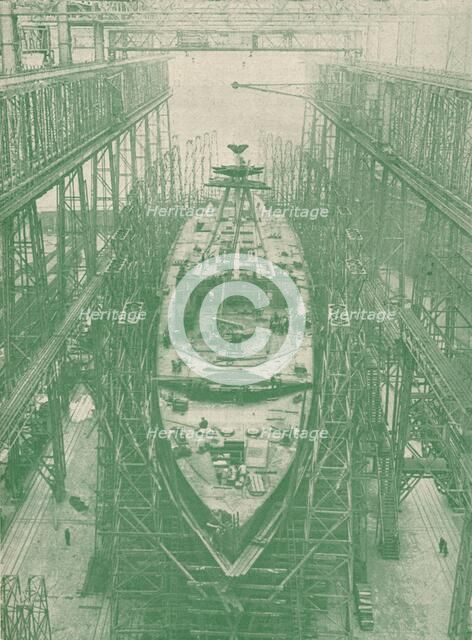 A light cruiser under construction, c1917 (1919). Artist: Unknown.