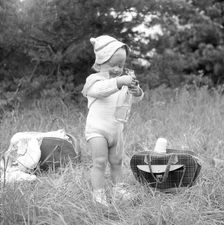 A little girl has found the picnic basket, Sweden, 1955