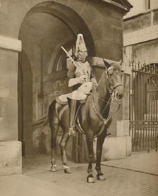 A Living Statue in Whitehall: The Lifeguards Sentry c1935. Creator: Unknown