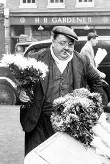 A London flower seller, Covent Garden Market, 1952. Creator: Henry Grant