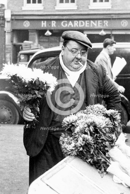 A London flower seller, Covent Garden Market, 1952. Creator: Henry Grant.