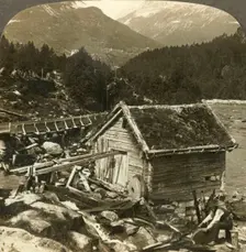 A log-built mill and a water-wheel grindstone, on Stalheim's river, Naerodal, Norway c1905. Creator: Unknown