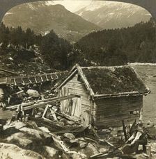A log-built mill and a water-wheel grindstone, on Stalheim's river, Naerodal, Norway c1905. Creator: Unknown