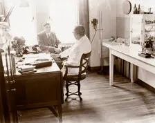 A man consults a Rowntree doctor in his surgery, York, Yorkshire, 1955