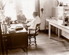 A man consults a Rowntree doctor in his surgery, York, Yorkshire, 1955