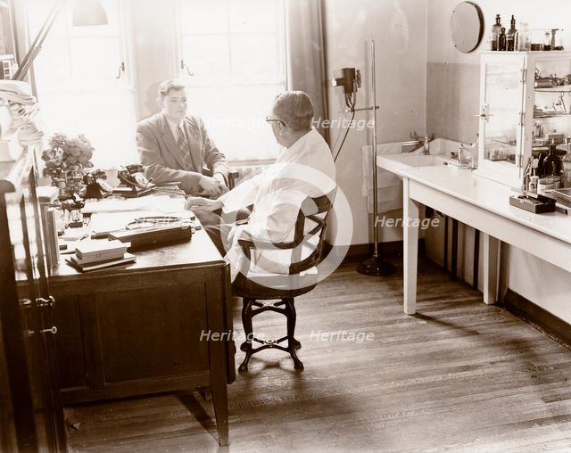 A man consults a Rowntree doctor in his surgery, York, Yorkshire, 1955. Artist: Unknown