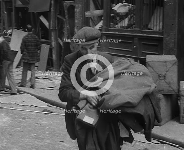 A Man Carrying His Possessions Away, 1940. Creator: British Pathe Ltd.