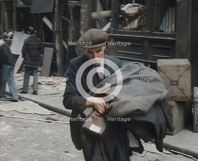 A Man Carrying His Possessions Away, 1940. Creator: British Pathe Ltd.