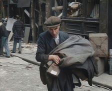 A Man Carrying His Possessions Away, 1940. Creator: British Pathe Ltd