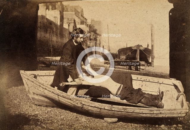 A man and a boy with bare torso in a rowing boat grounded on a beach..., c1860s. Creator: Unknown.
