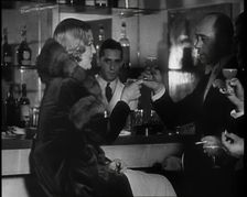 A Man and a Woman Drinking at a Nightclub, 1930s. Creator: British Pathe Ltd