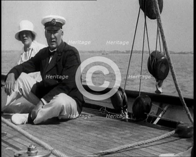 A Man and a Woman Sitting on the Deck of a Yacht at  Cowes, 1933. Creator: British Pathe Ltd.
