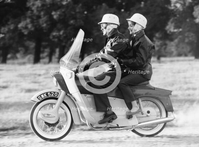 A man and a woman riding an Ariel Leader, 1958. Artist: Unknown