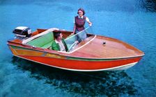 A man and woman in a Carter Craft wooden motor boat, Silver Springs, Florida, USA, 1956