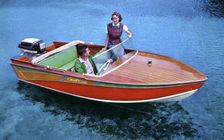 A man and woman in a Carter Craft wooden motor boat, Silver Springs, Florida, USA, 1956