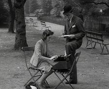 A Man and Woman Taking Notes in a Park, 1941. Creator: British Pathe Ltd