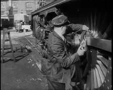 A Man Doing Maintenance Work on a Train Carriage, 1940. Creator: British Pathe Ltd