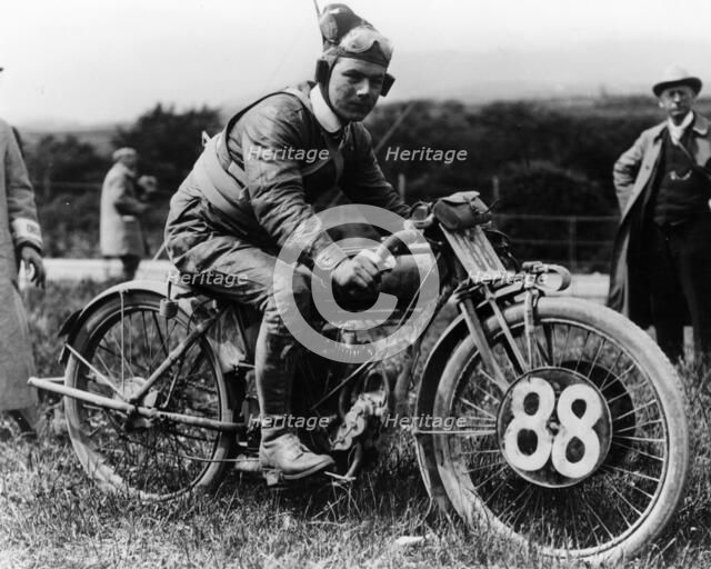 A man dressed in leathers on a Harley-Davidson. Artist: Unknown