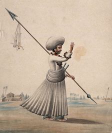 A man holding a long arrow with two puppets (?) hanging from it, (between 1800 and 1899?). Creator: Unknown