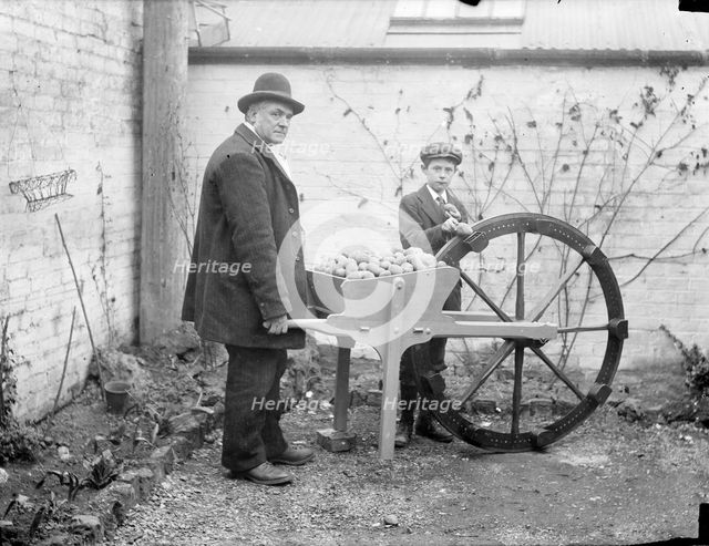 A man holding his potato planting invention, 1900. Artist: Henry Taunt