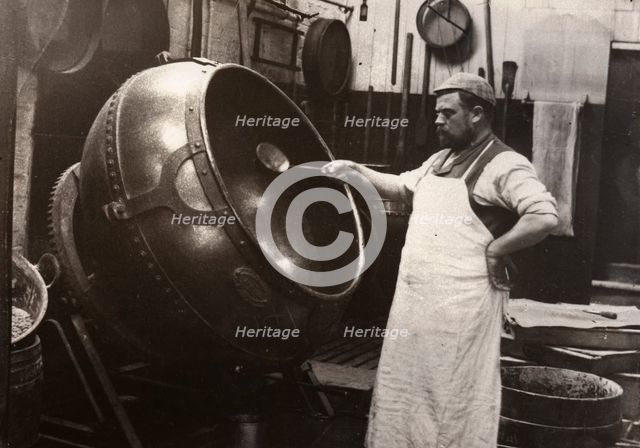 A man in an apron panning chocolate, Rowntree Cocoa Works, York, Yorkshire, 1900. Artist: Unknown