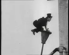 A Man on a Bendy Lamppost, 1930s. Creator: British Pathe Ltd