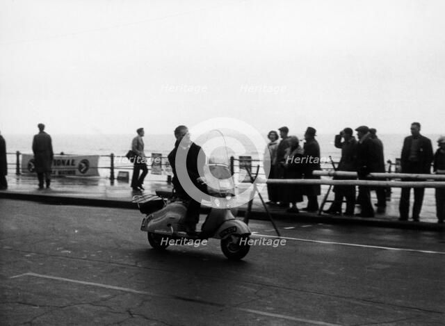 A man on a Lambretta scooter, taking part in the Daily Express rally, 1953. Artist: Unknown