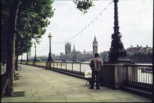 A man on the promenade on the south bank of the Thames near Hungerford Bridge...London, 1983. Creator: Dorothy Chapman