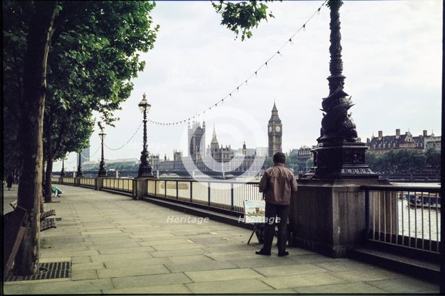 A man on the promenade on the south bank of the Thames near Hungerford Bridge...London, 1983. Creator: Dorothy Chapman.