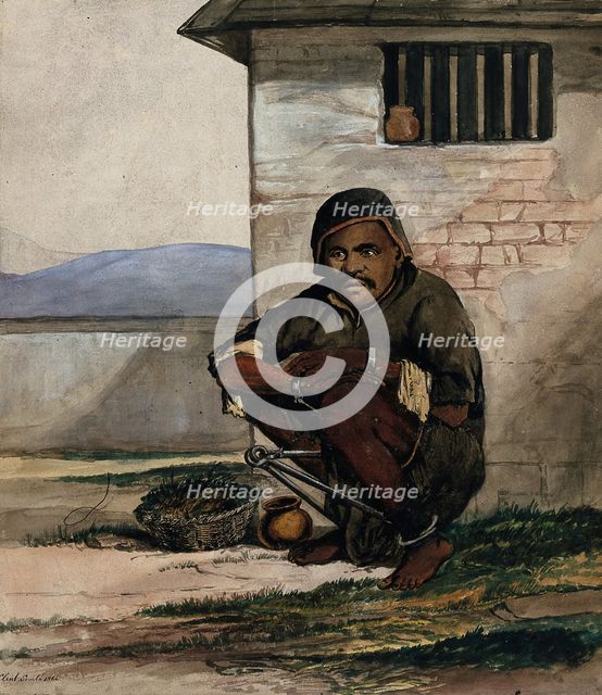 A man of Simla, squatting in a prison with manacles around his ankles, 1866. Creator: R Clint.
