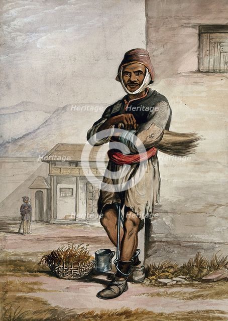 A man of Simla, standing in a prison with manacles around his ankles, 1866. Creator: R Clint.