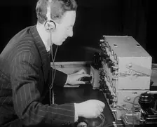 A Man Operating a Radio, 1940. Creator: British Pathe Ltd