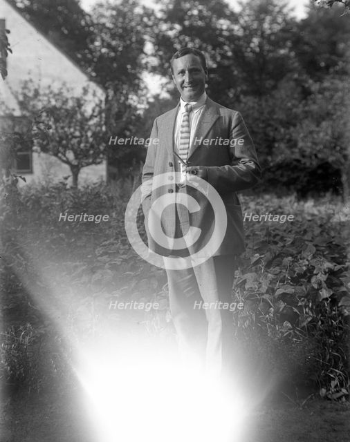A man smoking his pipe in the garden, Flyinge, Sweden, 1920s. Creator: Unknown.
