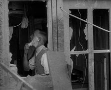 A Man Shaving in a Bombed Out House, 1940. Creator: British Pathe Ltd