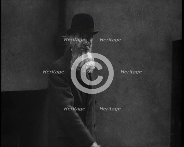 A Man Sporting a Beaver Beard Walking Along a Street, 1922. Creator: British Pathe Ltd.